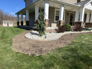 Beautiful front yard landscaping with young trees, mulch, and enhanced curb appeal in Indiana Pennsylvania