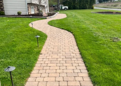 brick walkway cutting a lawn in two