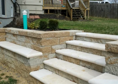 stone block retaining wall with fresh stone steps